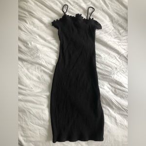 M boutique black ribbed cotton dress with lettuce leaf edging.